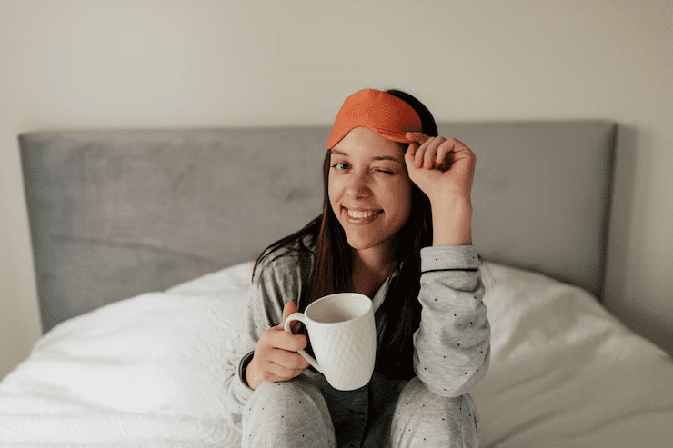 Natural Sleep Aids: How Hemp Can Improve Your Sleep Quality 3 close up portrait charming smiling woman bed with morning cup coffee winking holding sleeping mask 291650 129
